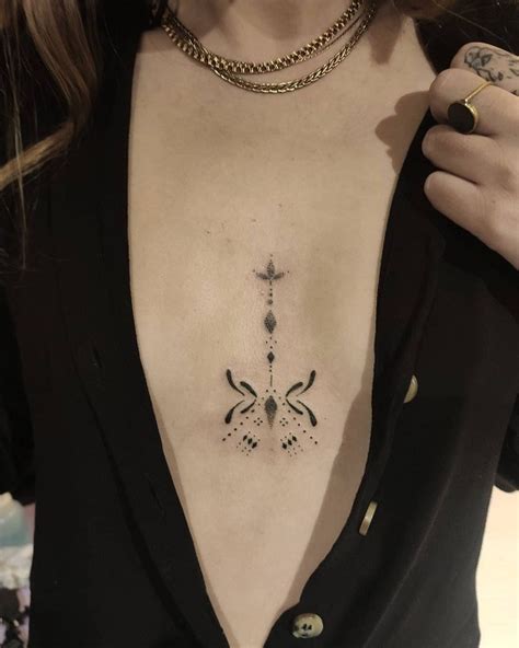 small tattoos between breast|Breast Tattoos